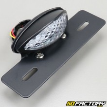 White oval lens tail light with license plate holder
